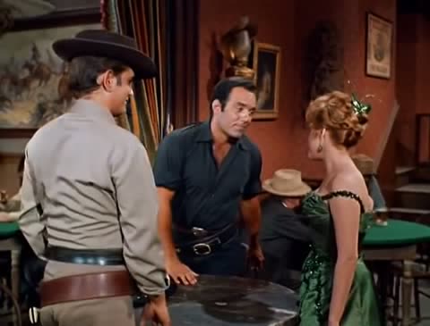 Three people talking in a saloon